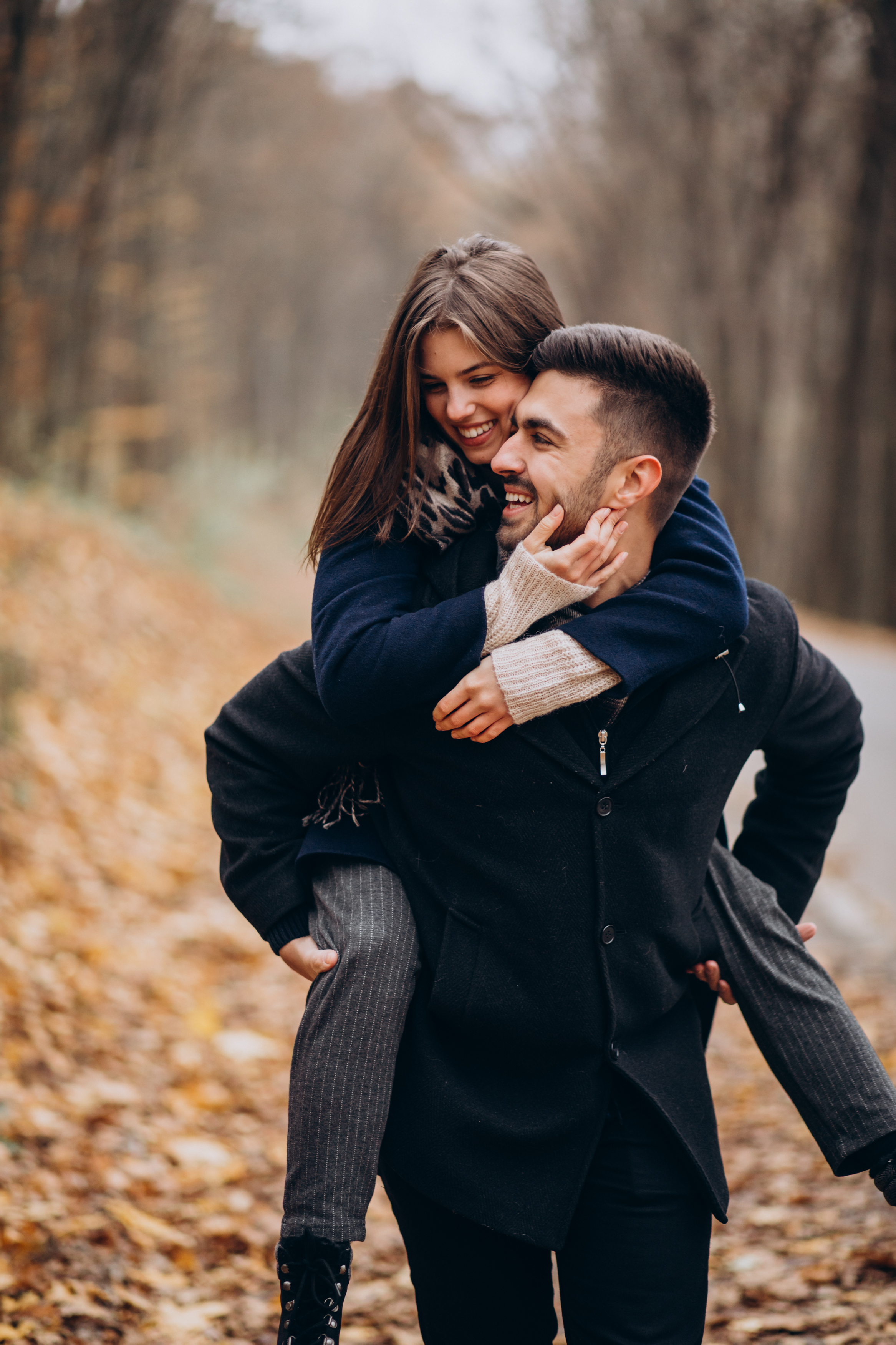 Youngx couple together walking in an autumn park